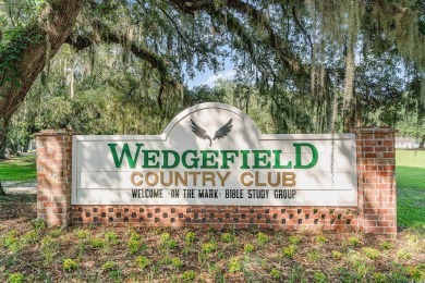 CHECK OUT THIS COZY LOW COUNTRY HOME!!!! This home sits on a on Wedgefield Plantation Golf Club in South Carolina - for sale on GolfHomes.com, golf home, golf lot