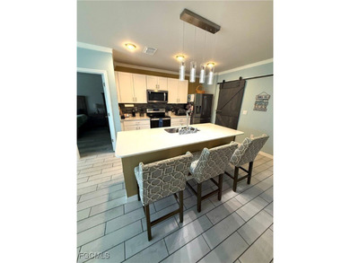 Located within the Magnolia Landing community, this residence on Herons Glen Golf and Country Club in Florida - for sale on GolfHomes.com, golf home, golf lot