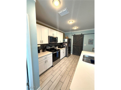 Located within the Magnolia Landing community, this residence on Herons Glen Golf and Country Club in Florida - for sale on GolfHomes.com, golf home, golf lot