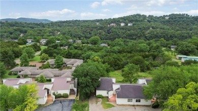 Welcome to this inviting 3-bedroom, 2-bath end-unit condo just on Holiday Island Executive Golf Course in Arkansas - for sale on GolfHomes.com, golf home, golf lot