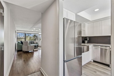 Welcome to this stunning, move-in-ready, FULLY FURNISHED dream on Cove Cay Country Club in Florida - for sale on GolfHomes.com, golf home, golf lot