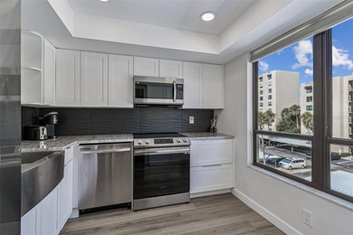 Welcome to this stunning, move-in-ready, FULLY FURNISHED dream on Cove Cay Country Club in Florida - for sale on GolfHomes.com, golf home, golf lot