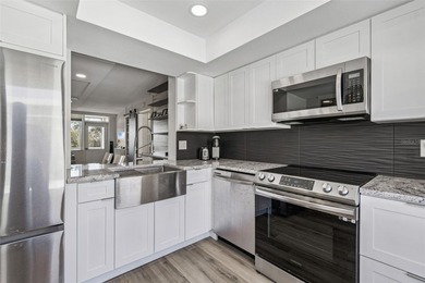 Welcome to this stunning, move-in-ready, FULLY FURNISHED dream on Cove Cay Country Club in Florida - for sale on GolfHomes.com, golf home, golf lot