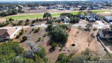 Beautiful level lot located in Rockin' J Ranch that backs up to on Vaaler Creek Golf Club in Texas - for sale on GolfHomes.com, golf home, golf lot