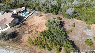 Beautiful level lot located in Rockin' J Ranch that backs up to on Vaaler Creek Golf Club in Texas - for sale on GolfHomes.com, golf home, golf lot