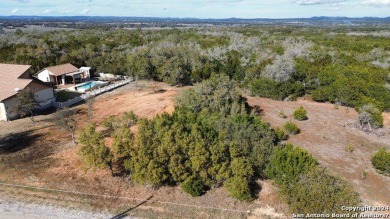 Beautiful level lot located in Rockin' J Ranch that backs up to on Vaaler Creek Golf Club in Texas - for sale on GolfHomes.com, golf home, golf lot