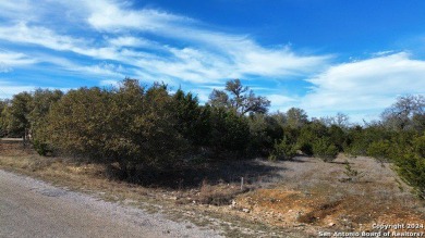 Beautiful level lot located in Rockin' J Ranch that backs up to on Vaaler Creek Golf Club in Texas - for sale on GolfHomes.com, golf home, golf lot