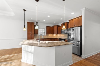 Beautifully built by Trusst, this freshly painted townhome is on Cape Fear National At Brunswick Forest in North Carolina - for sale on GolfHomes.com, golf home, golf lot