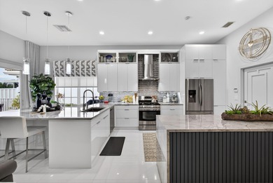 STUNNING NEWLY RE-IMAGINED POOL HOME NESTLED ON PREMIER GOLF on Ibis Golf and Country Club in Florida - for sale on GolfHomes.com, golf home, golf lot