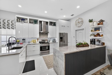 STUNNING NEWLY RE-IMAGINED POOL HOME NESTLED ON PREMIER GOLF on Ibis Golf and Country Club in Florida - for sale on GolfHomes.com, golf home, golf lot