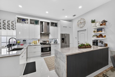 STUNNING NEWLY RE-IMAGINED POOL HOME NESTLED ON PREMIER GOLF on Ibis Golf and Country Club in Florida - for sale on GolfHomes.com, golf home, golf lot