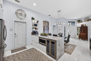 STUNNING NEWLY RE-IMAGINED POOL HOME NESTLED ON PREMIER GOLF on Ibis Golf and Country Club in Florida - for sale on GolfHomes.com, golf home, golf lot