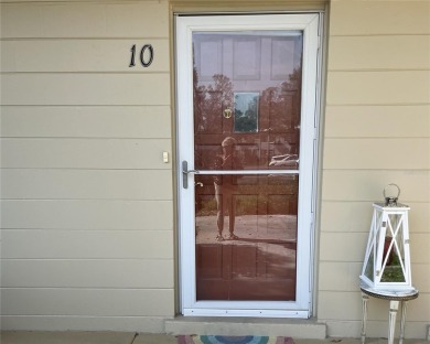 1st floor unit with  Beautiful laminate flooring throughout on On Top Of The World Golf Course in Florida - for sale on GolfHomes.com, golf home, golf lot