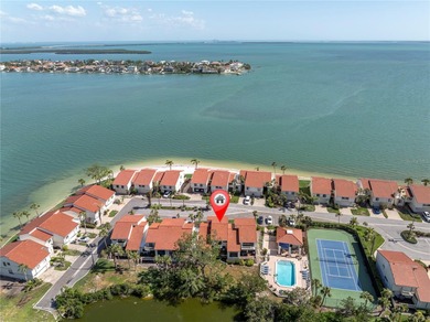 STUNNING COASTAL 3 BEDROOM, 2.5 BATH TOWNHOME WITH 1915 HSF OF on Isla Del Sol Yacht and Country Club in Florida - for sale on GolfHomes.com, golf home, golf lot