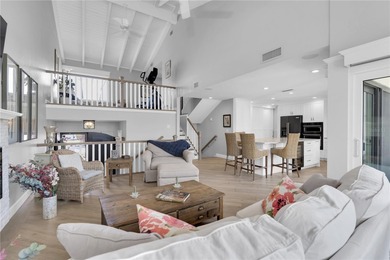 STUNNING COASTAL 3 BEDROOM, 2.5 BATH TOWNHOME WITH 1915 HSF OF on Isla Del Sol Yacht and Country Club in Florida - for sale on GolfHomes.com, golf home, golf lot