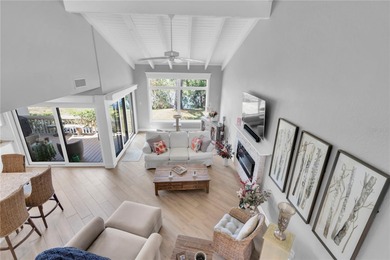 STUNNING COASTAL 3 BEDROOM, 2.5 BATH TOWNHOME WITH 1915 HSF OF on Isla Del Sol Yacht and Country Club in Florida - for sale on GolfHomes.com, golf home, golf lot