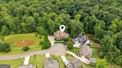 Welcome to Traditions of Braselton, enjoy a beautiful drive thru on Traditions of Braselton Golf Club in Georgia - for sale on GolfHomes.com, golf home, golf lot