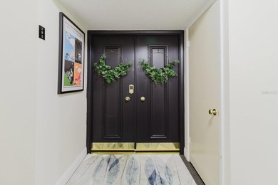 Experience refined coastal living at its finest in this on Belleair Country Club in Florida - for sale on GolfHomes.com, golf home, golf lot