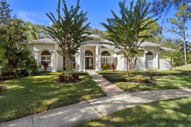 Introducing an impeccably maintained estate home nestled within on Tampa Palms Golf and Country Club in Florida - for sale on GolfHomes.com, golf home, golf lot