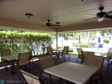 *Fully renovated first-floor condo in lush Palm Aire featuring on Palm-Aire Country Club and Resort - Palms in Florida - for sale on GolfHomes.com, golf home, golf lot