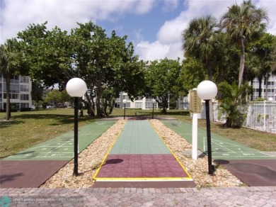*Fully renovated first-floor condo in lush Palm Aire featuring on Palm-Aire Country Club and Resort - Palms in Florida - for sale on GolfHomes.com, golf home, golf lot