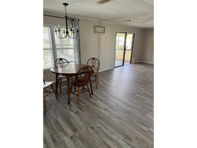 Welcome to this charming home nestled in a vibrant 55+ gated on The Meadows At Countrywood in Florida - for sale on GolfHomes.com, golf home, golf lot