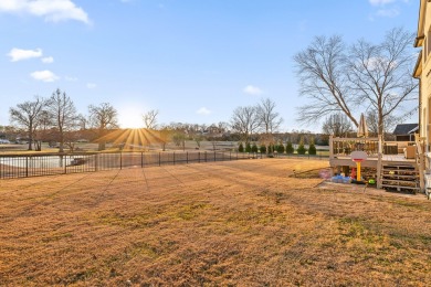 Discover timeless elegance in this nearly 3,600 sq ft, 4-bedroom on The Champions Club At Hampton Creek in Tennessee - for sale on GolfHomes.com, golf home, golf lot