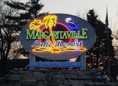 Located next to Margaritaville, this vibrant, iconic community on The Oaks Golf Course in Missouri - for sale on GolfHomes.com, golf home, golf lot