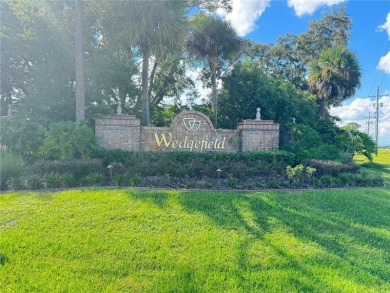 Tucked away from the rush of city living, this 1.03-acre lot in on Wedgefield Golf Club in Florida - for sale on GolfHomes.com, golf home, golf lot