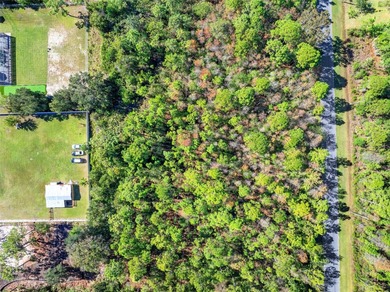 Tucked away from the rush of city living, this 1.03-acre lot in on Wedgefield Golf Club in Florida - for sale on GolfHomes.com, golf home, golf lot