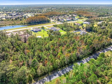 Tucked away from the rush of city living, this 1.03-acre lot in on Wedgefield Golf Club in Florida - for sale on GolfHomes.com, golf home, golf lot