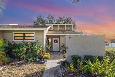 Step into this beautifully updated 2-bedroom, 2-bath end unit on Imperial Lakes Country Club in Florida - for sale on GolfHomes.com, golf home, golf lot