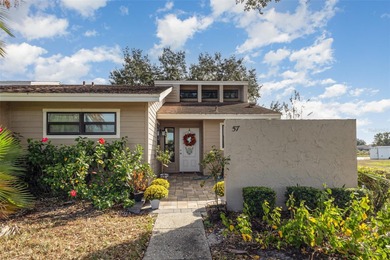 Step into this beautifully updated 2-bedroom, 2-bath end unit on Imperial Lakes Country Club in Florida - for sale on GolfHomes.com, golf home, golf lot