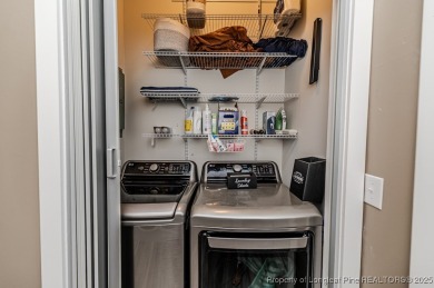 Seller has outgrown this beautifully updated 2-bedroom on Carolina Trace Country Club in North Carolina - for sale on GolfHomes.com, golf home, golf lot