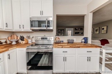 Seller has outgrown this beautifully updated 2-bedroom on Carolina Trace Country Club in North Carolina - for sale on GolfHomes.com, golf home, golf lot