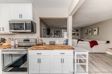 Seller has outgrown this beautifully updated 2-bedroom on Carolina Trace Country Club in North Carolina - for sale on GolfHomes.com, golf home, golf lot