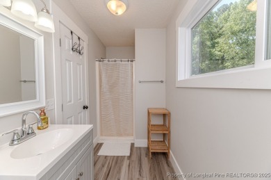 Seller has outgrown this beautifully updated 2-bedroom on Carolina Trace Country Club in North Carolina - for sale on GolfHomes.com, golf home, golf lot