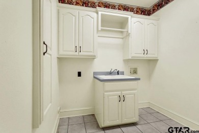 Welcome to this Traditional Red Brick home located on a highly on Hide-A-Way Lake Golf Course in Texas - for sale on GolfHomes.com, golf home, golf lot