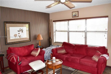 Completely furnished condo overlooking one of the pool areas is on Sunrise Lakes Phase III in Florida - for sale on GolfHomes.com, golf home, golf lot