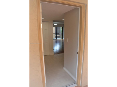 Experience serenity in this stunning 1-bedroom, 1-bathroom on Jacaranda Golf Club in Florida - for sale on GolfHomes.com, golf home, golf lot