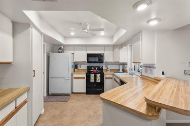 Welcome to this beautifully maintained waterfront home located on Jacaranda West Country Club in Florida - for sale on GolfHomes.com, golf home, golf lot