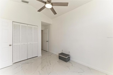 Discover the perfect blend of comfort, style, and convenience in on Palm Aire Country Club of Sarasota in Florida - for sale on GolfHomes.com, golf home, golf lot