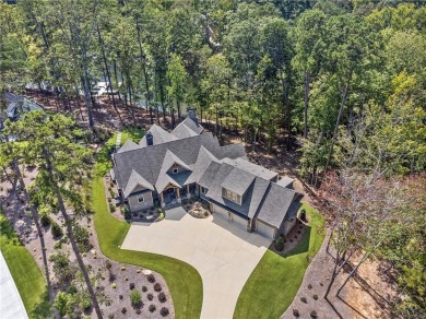 Indulge in the epitome of lakeside luxury with this exquisite on Reynolds Lake Oconee - The Oconee in Georgia - for sale on GolfHomes.com, golf home, golf lot