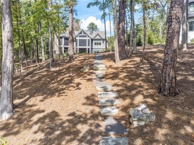 Indulge in the epitome of lakeside luxury with this exquisite on Reynolds Lake Oconee - The Oconee in Georgia - for sale on GolfHomes.com, golf home, golf lot