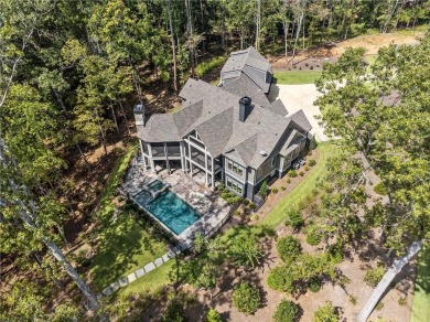 Indulge in the epitome of lakeside luxury with this exquisite on Reynolds Lake Oconee - The Oconee in Georgia - for sale on GolfHomes.com, golf home, golf lot