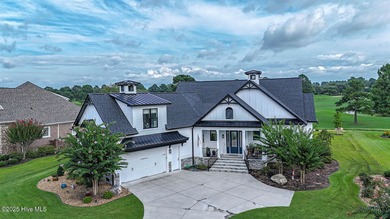 INCREDIBLE CURB APPEAL and stunning green-to-tee views of the #1 on Crow Creek Golf Club in North Carolina - for sale on GolfHomes.com, golf home, golf lot