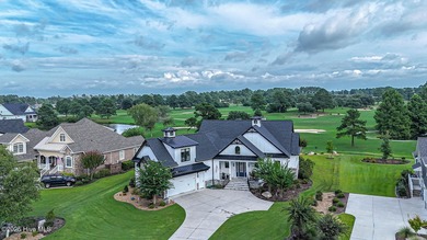 INCREDIBLE CURB APPEAL and stunning green-to-tee views of the #1 on Crow Creek Golf Club in North Carolina - for sale on GolfHomes.com, golf home, golf lot