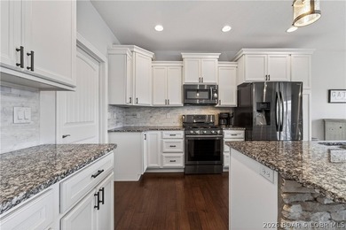 Set along the gorgeous shoreline of Lake of the Ozarks, this on Bayview Golf Course in Missouri - for sale on GolfHomes.com, golf home, golf lot