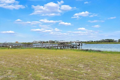 This lovely 3 bedroom 3 bathroom waterfront home was built in on Brick Landing Plantation Yacht and Golf Club in North Carolina - for sale on GolfHomes.com, golf home, golf lot