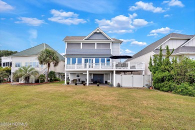 This lovely 3 bedroom 3 bathroom waterfront home was built in on Brick Landing Plantation Yacht and Golf Club in North Carolina - for sale on GolfHomes.com, golf home, golf lot